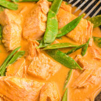 thai coconut red curry salmon in skillet