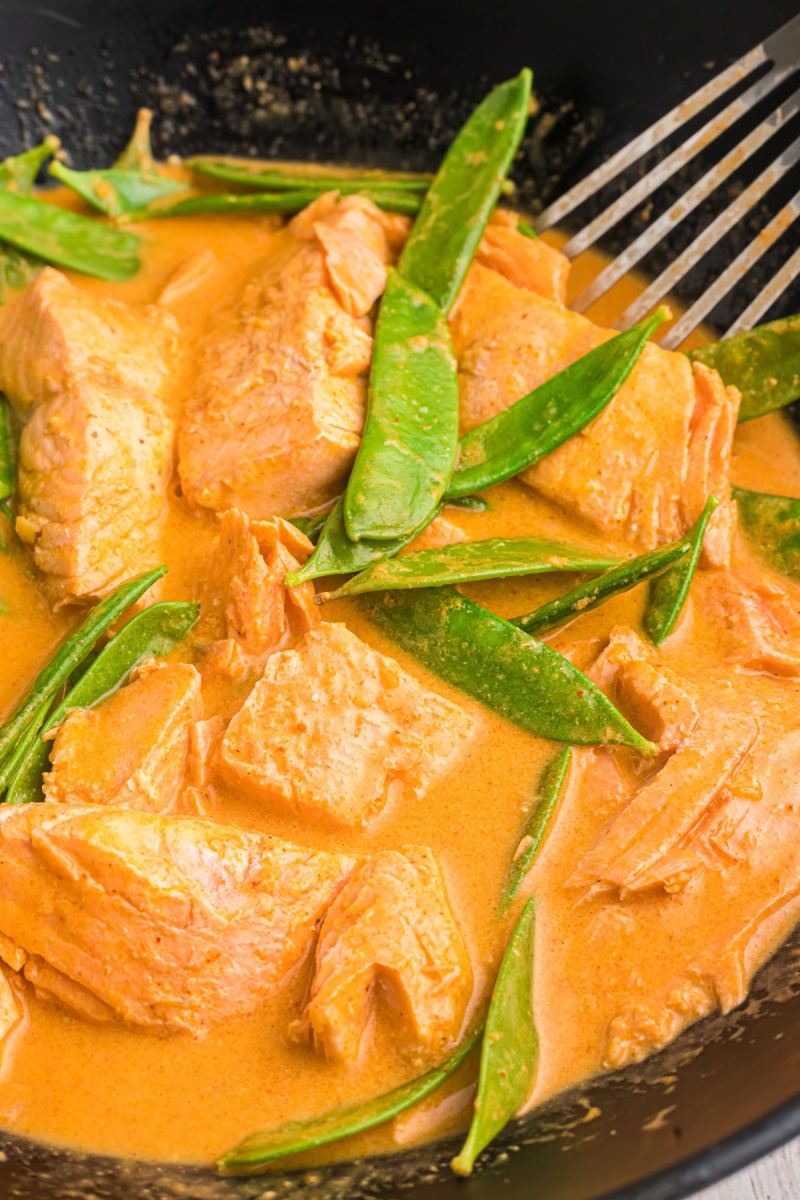 thai coconut red curry salmon in skillet