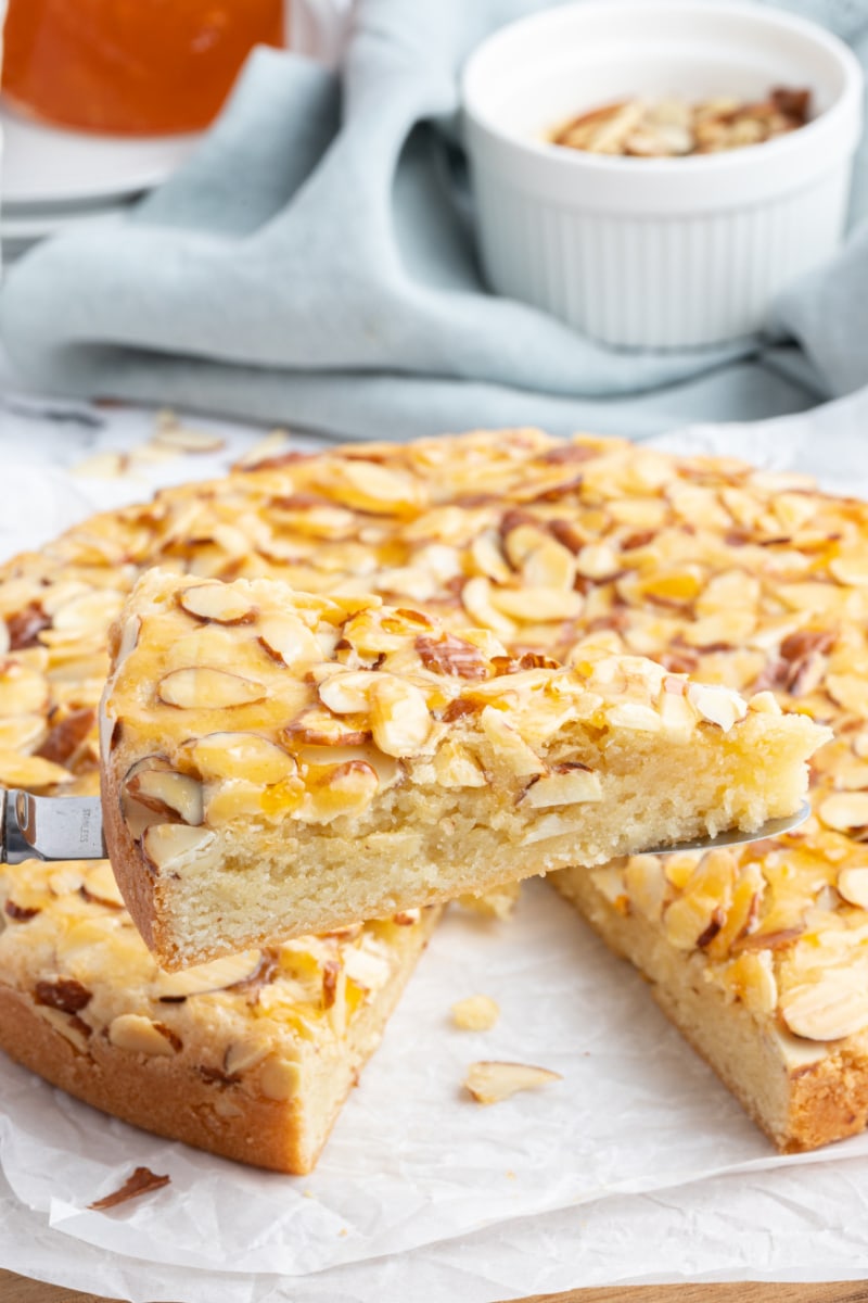 spatula holding up french almond cake