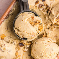 scoops of maple walnut ice cream on top of tub of ice cream