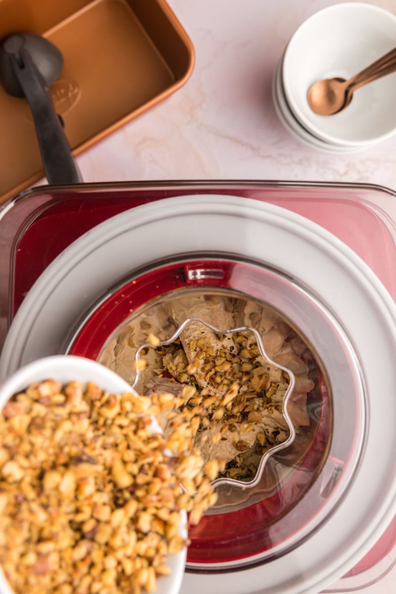 pouring walnuts into ice cream maker