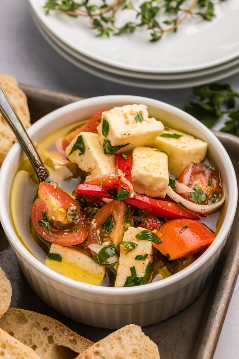 bowl of marinated feta with cherry tomatoes