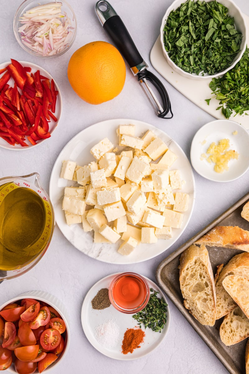 ingredients displayed for making marinated feta with cherry tomatoes