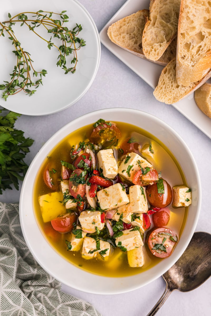 bowl of marinated feta with cherry tomatoes