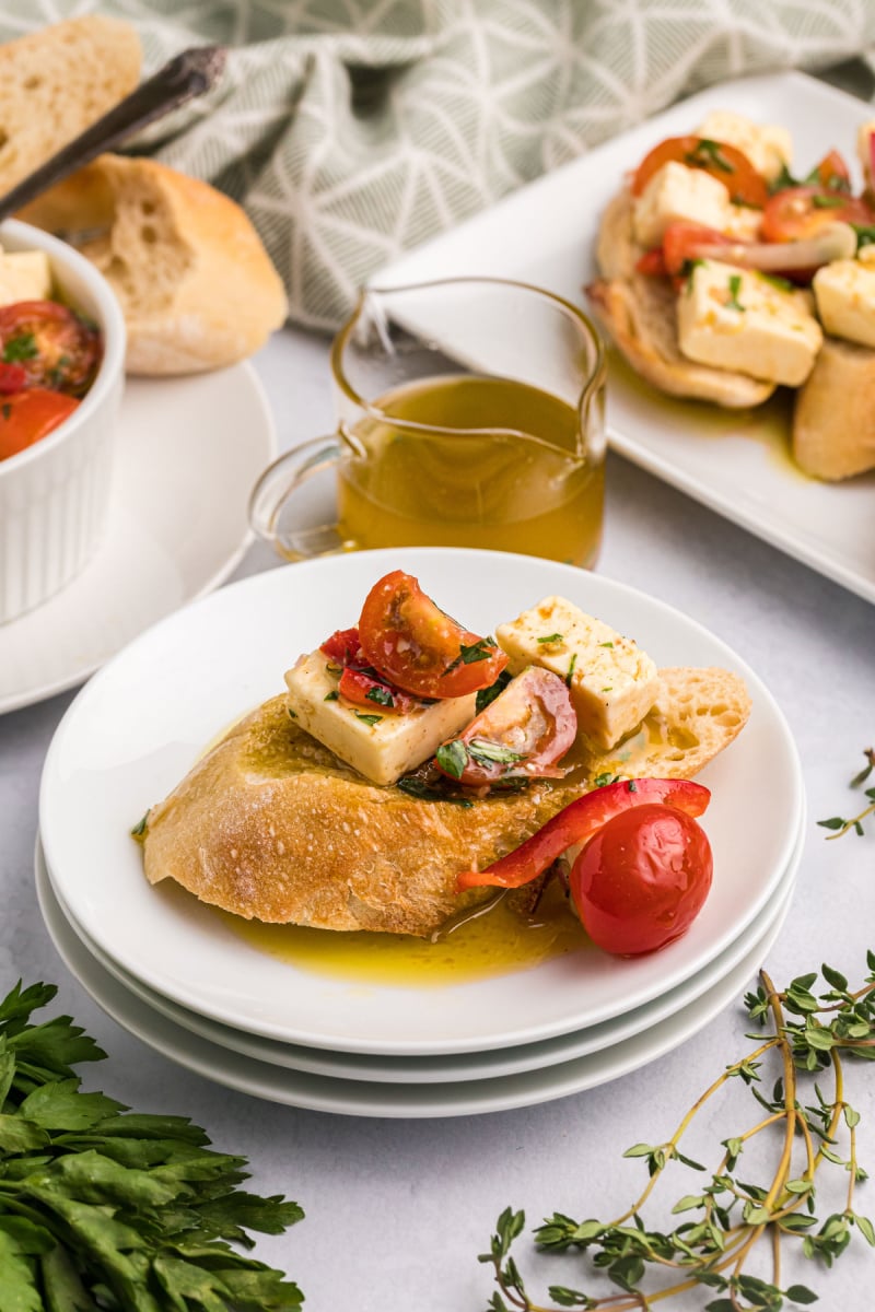 baguette slice with feta and tomatoes on top