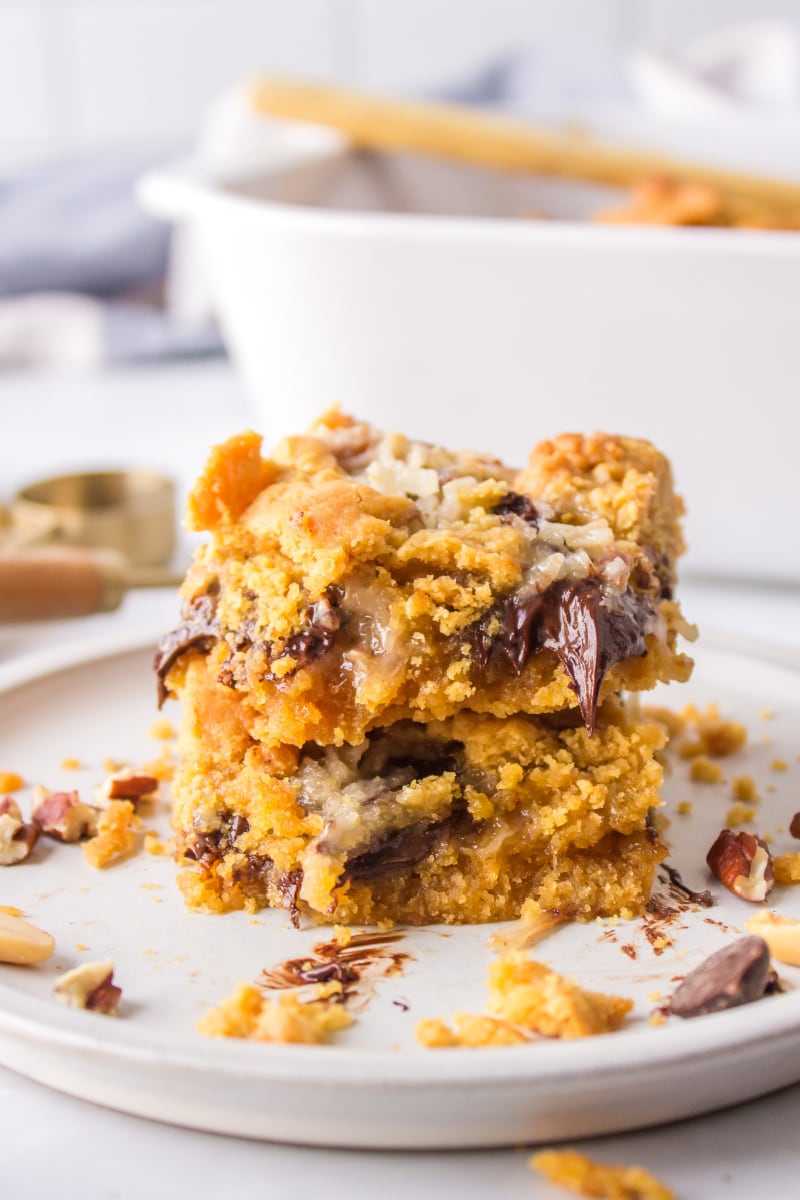 two peanut butter fudge bars stacked on plate