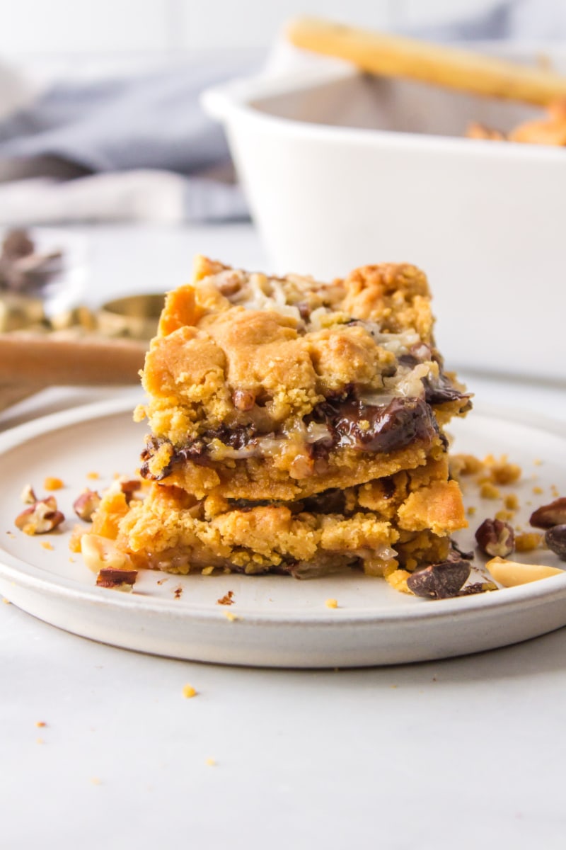 two peanut butter fudge bars stacked on plate