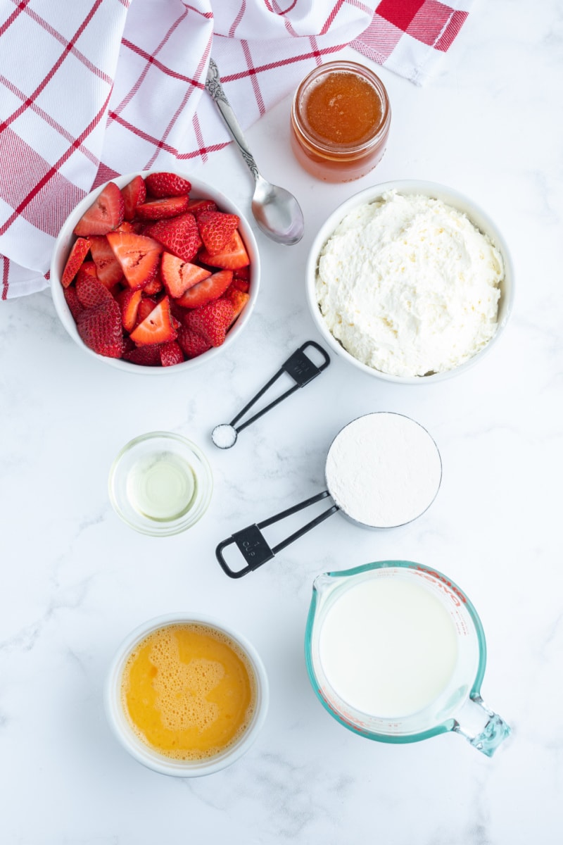 ingredients displayed for making strawberry cream cheese crepes