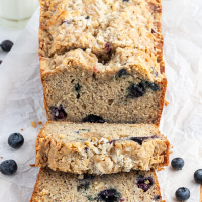 loaf of blueberry coconut banana bread cut into slices