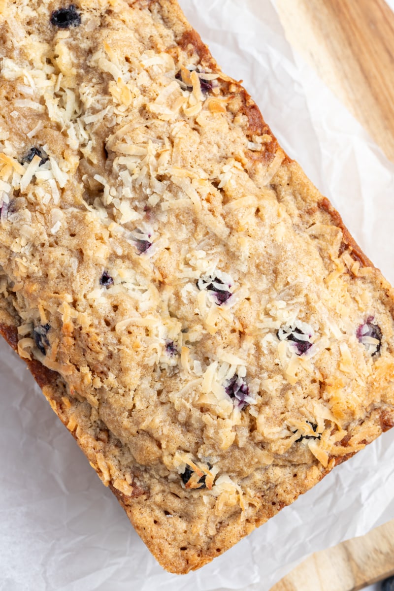 overhead shot of loaf of coconut blueberry banana bread