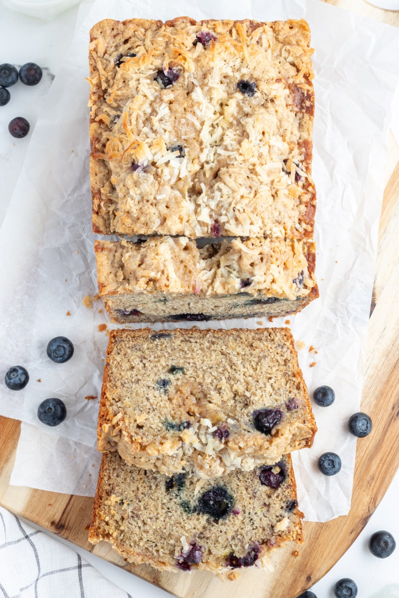 overhead shot of loaf of coconut blueberry banana bread sliced