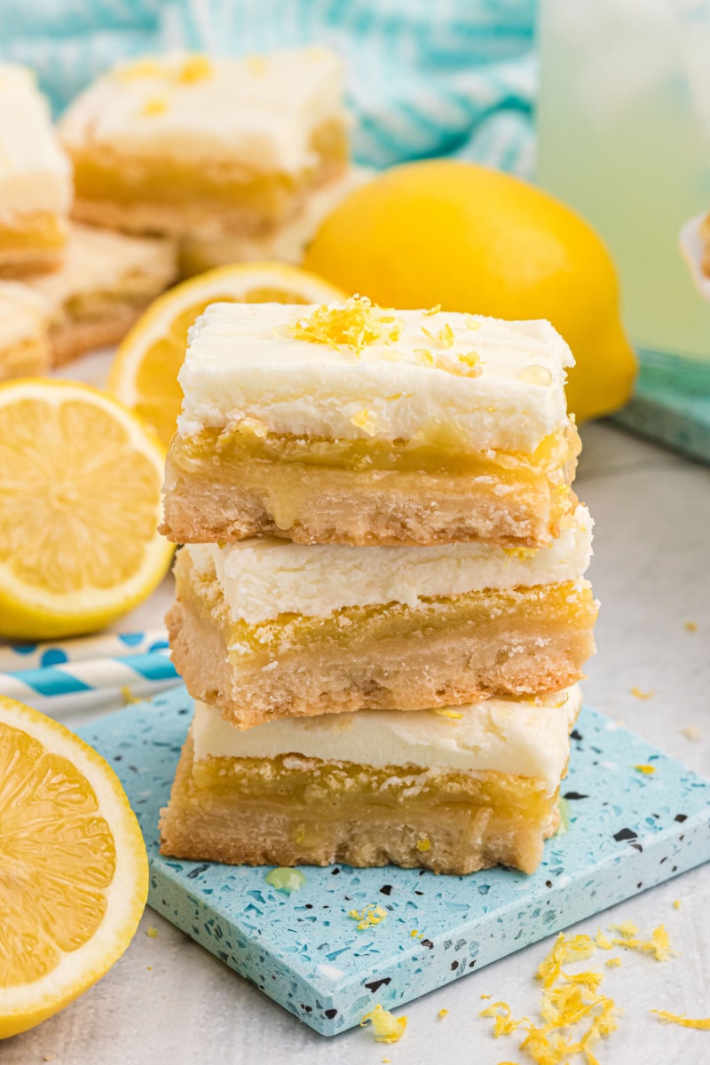 three frosted lemon bars stacked