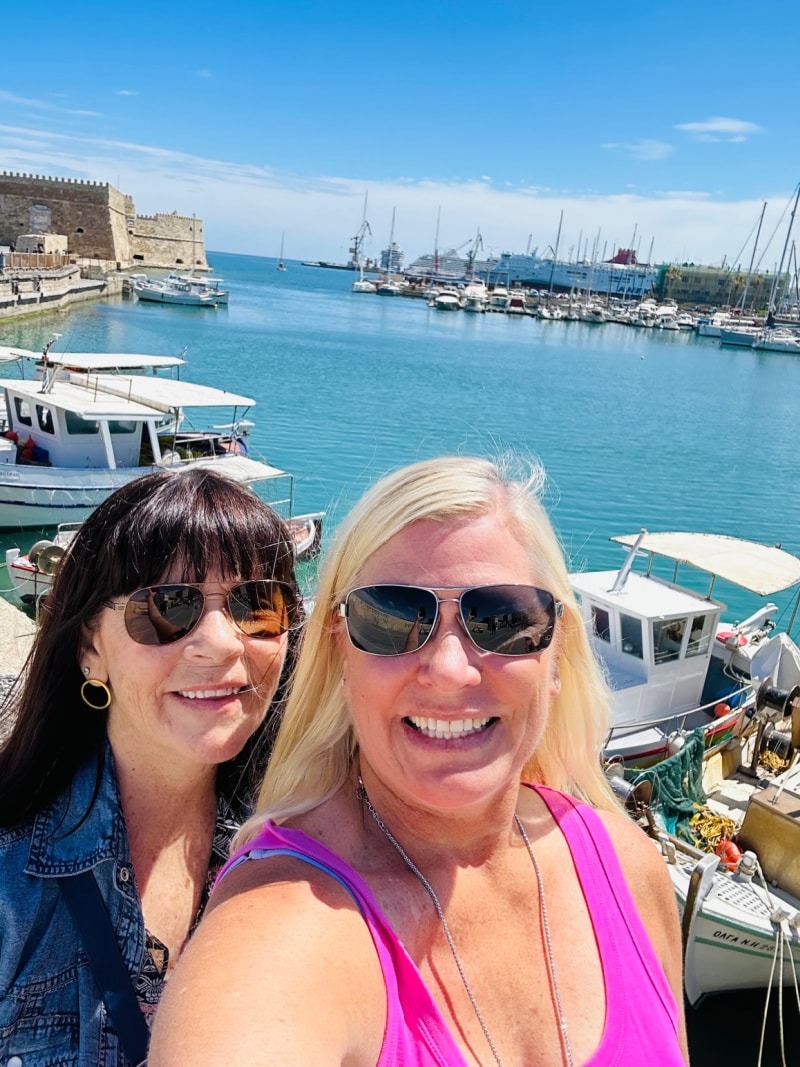 recipegirl and sister in greece with ocean background