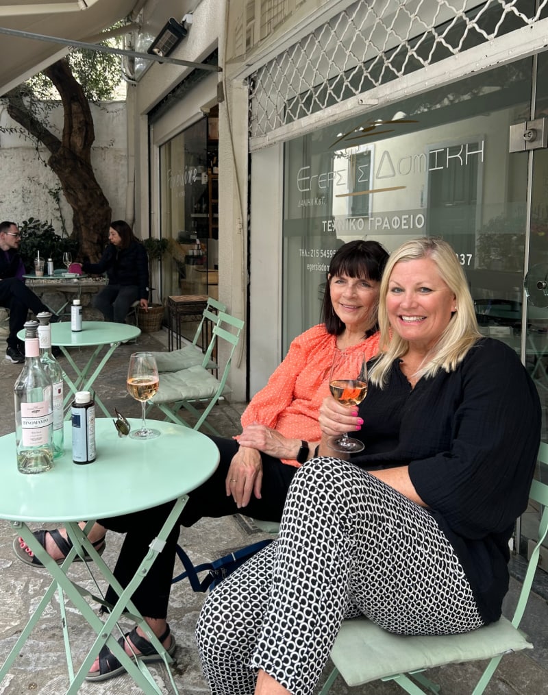 recipegirl and sister drinking wine in greece