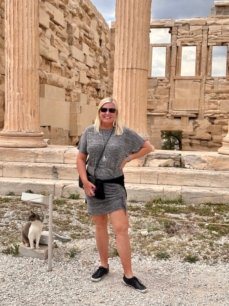 recipegirl in front of greek ruins at acropolis