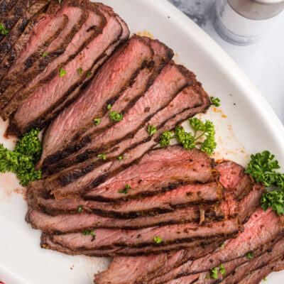 sliced tri tip on a platter