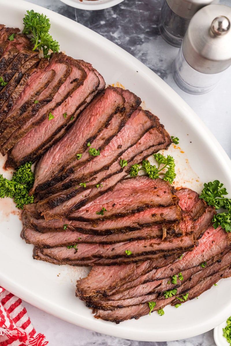 sliced tri tip on a platter