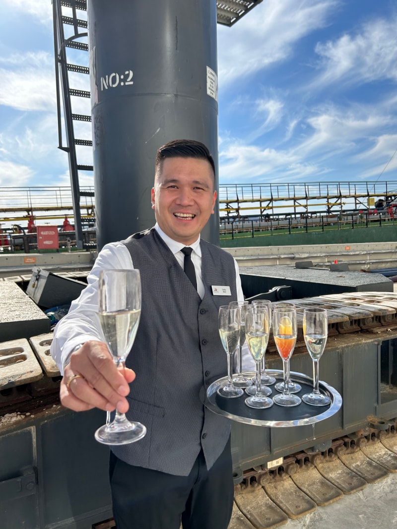 viking employee offering champagne