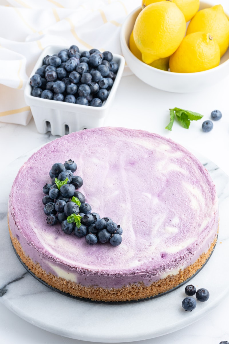 blueberry lemon cheesecake with fresh blueberries on top