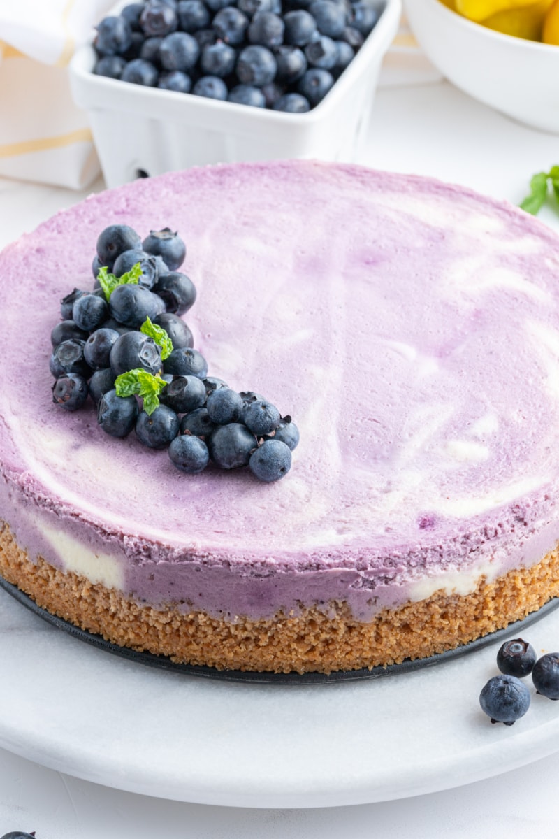 blueberry lemon cheesecake with fresh blueberries on top