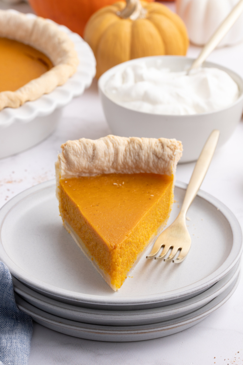 slice of pumpkin pie on plate with fork