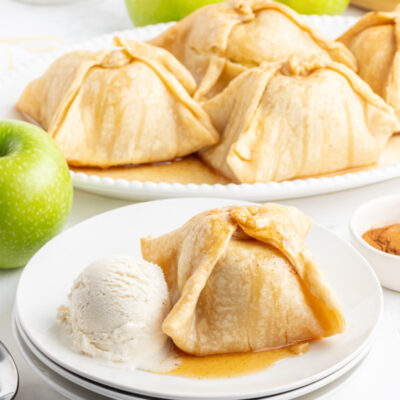 apple dumpling on plate with ice cream