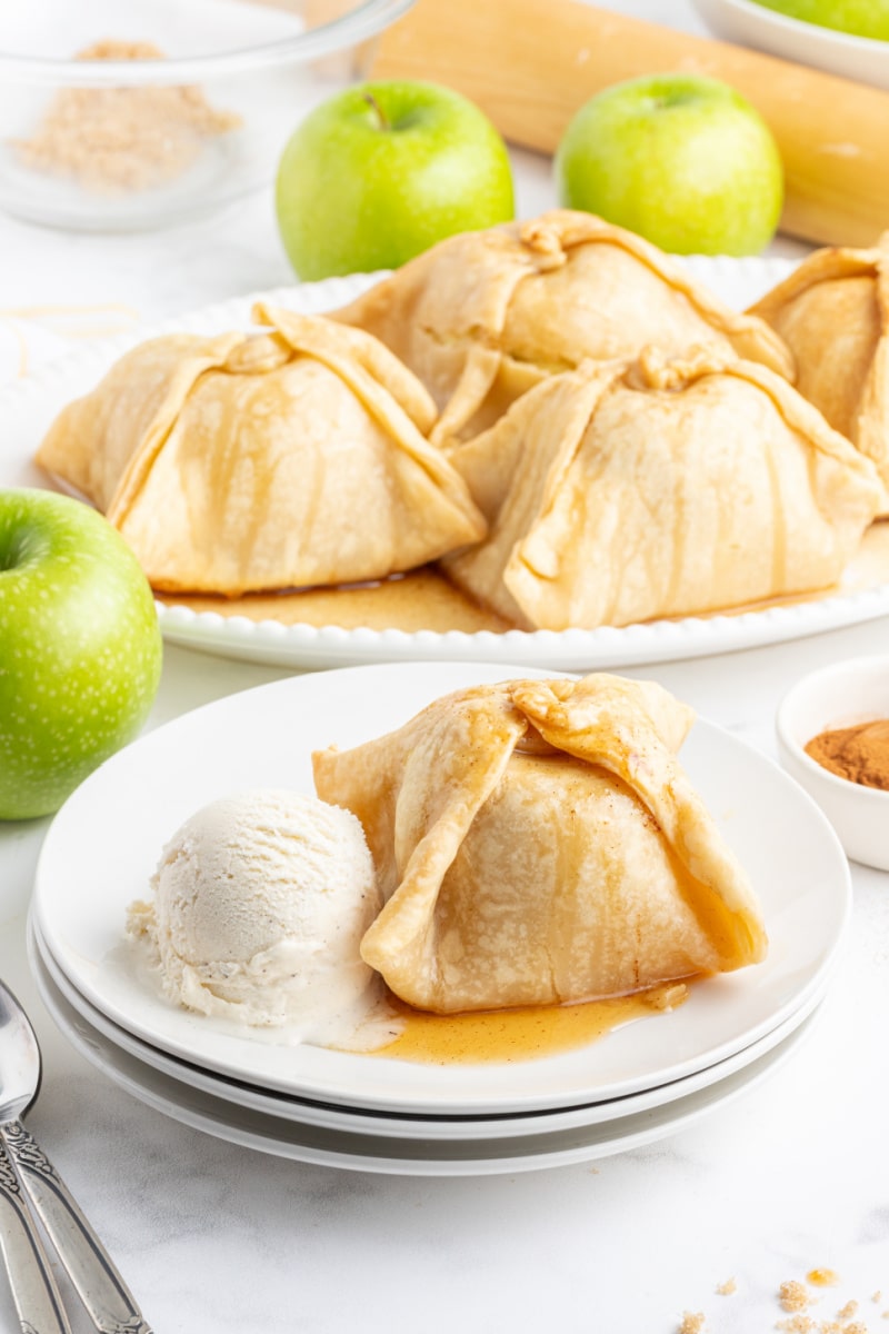 apple dumpling on plate with ice cream