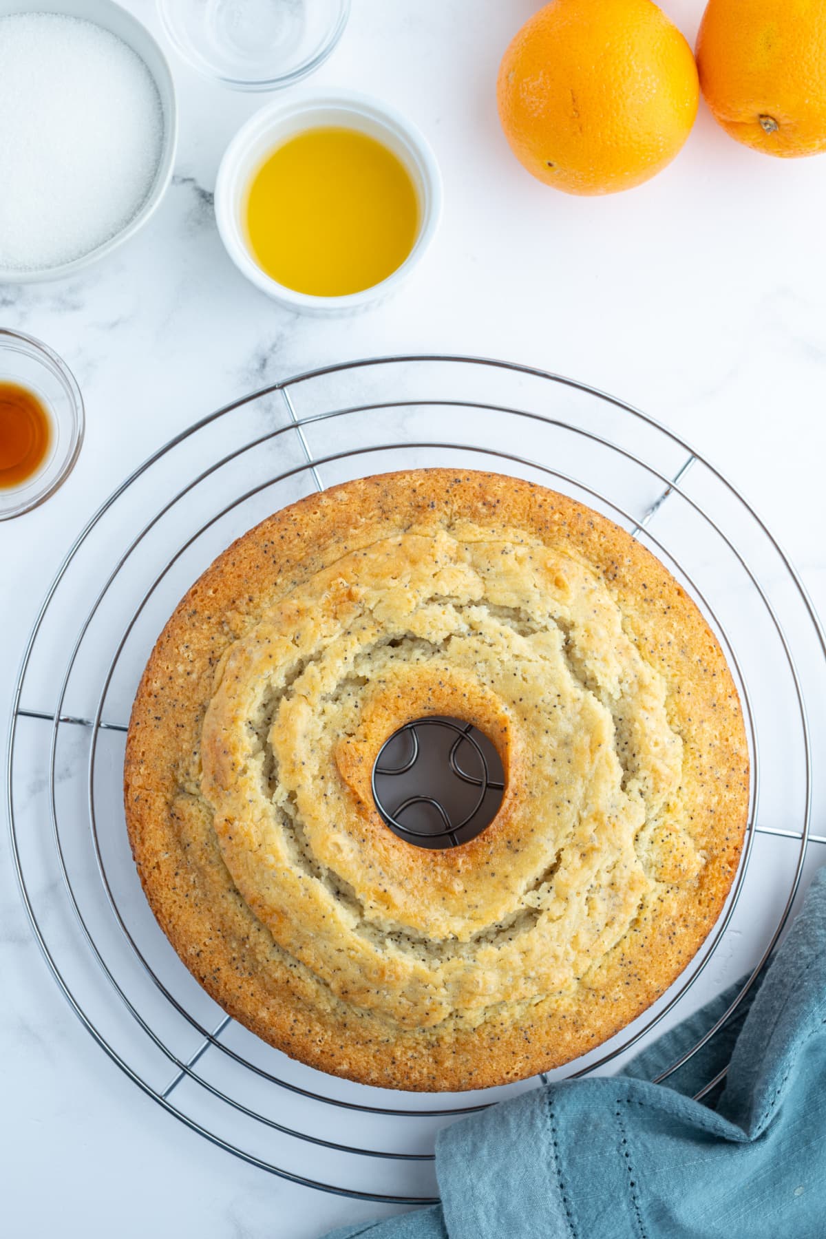 almond orange poppy seed cake on cooling rack