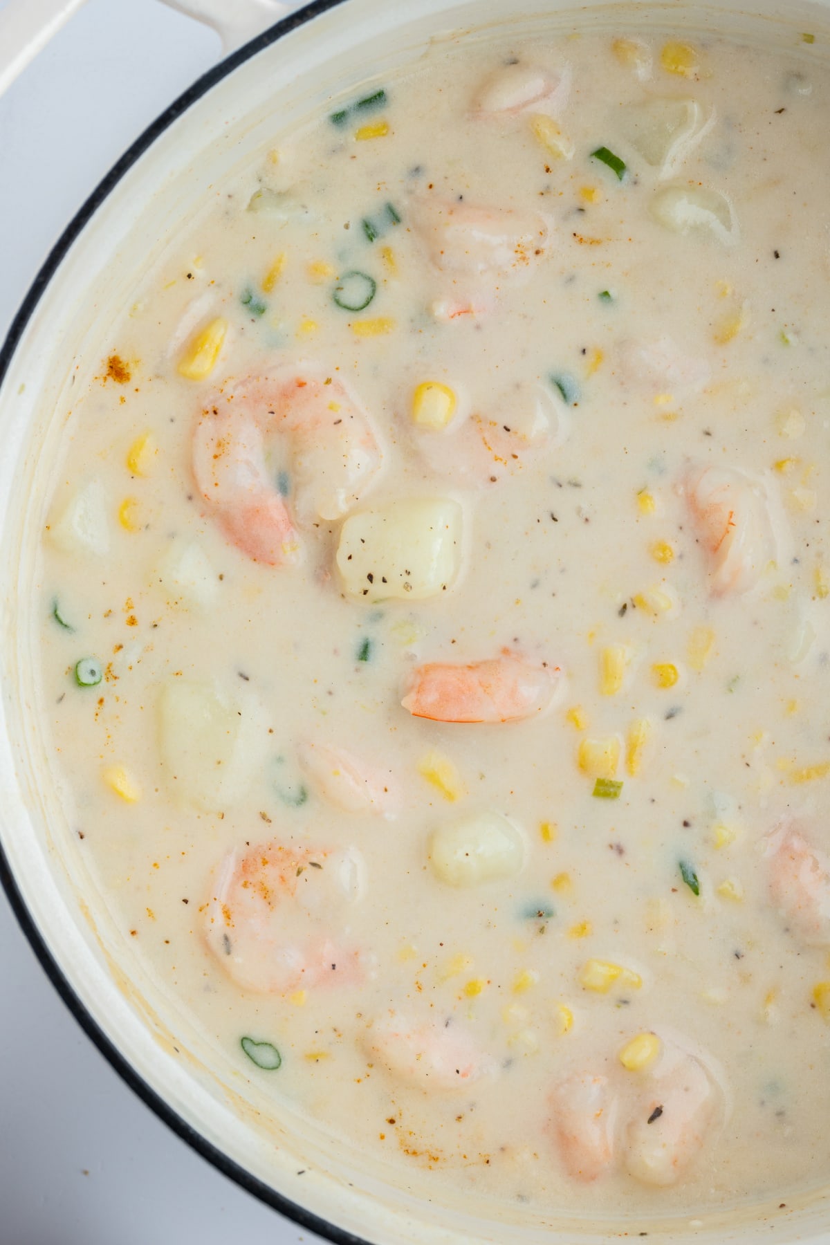 corn and shrimp chowder in pot