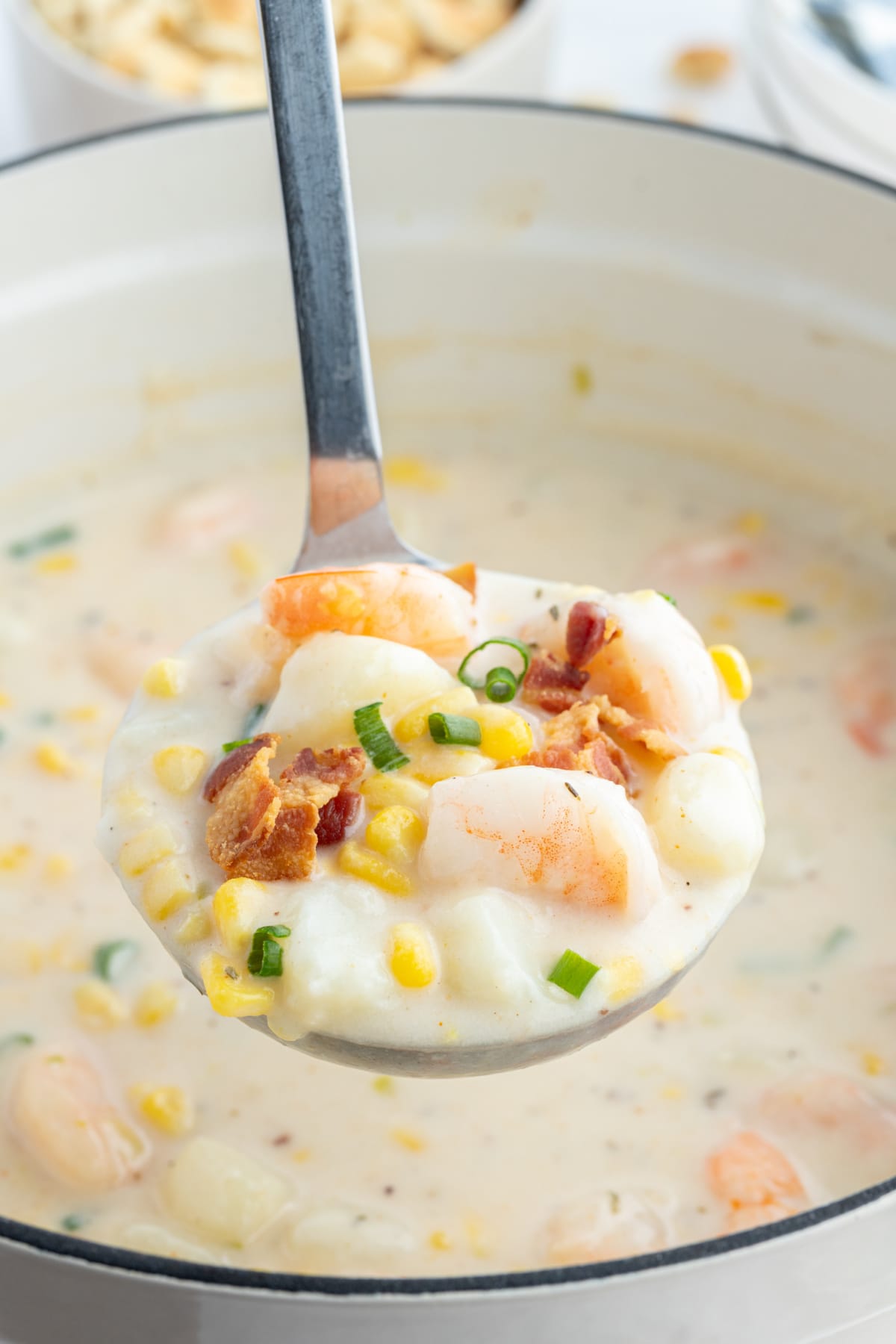 ladle full of corn and shrimp chowder