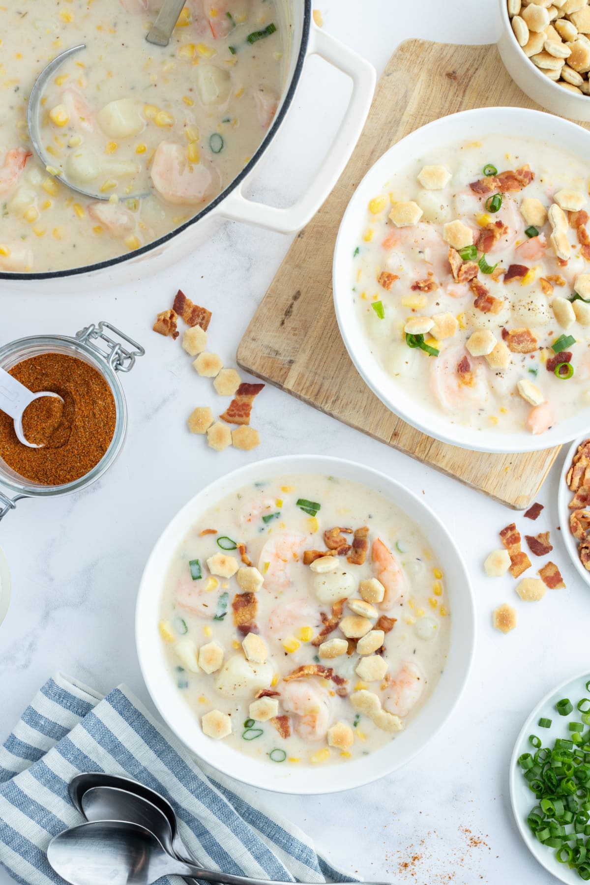 two bowls of corn and shrimp chowder