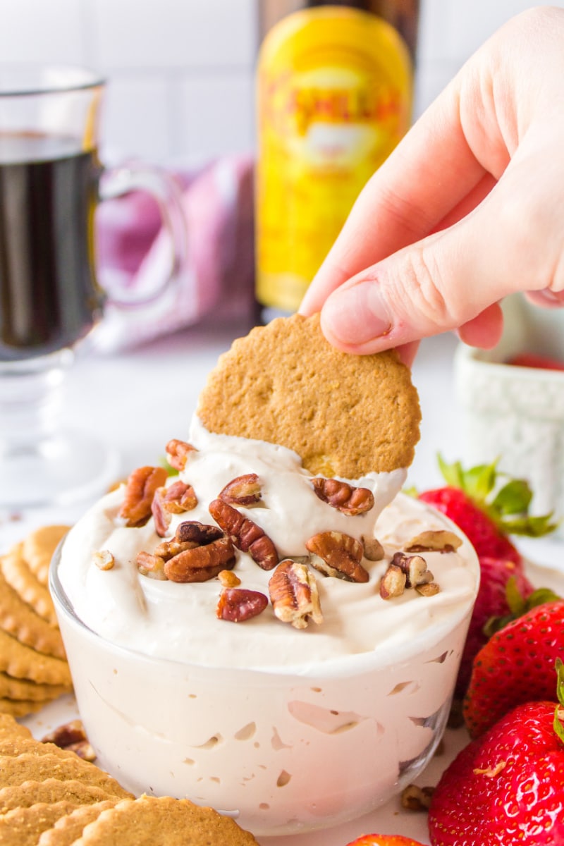 dipping cookie into kahlua dip