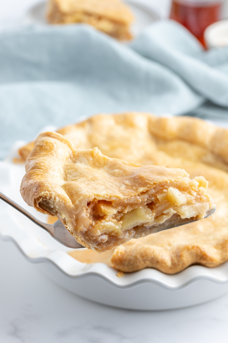 spatula taking out slice of maple apple pie