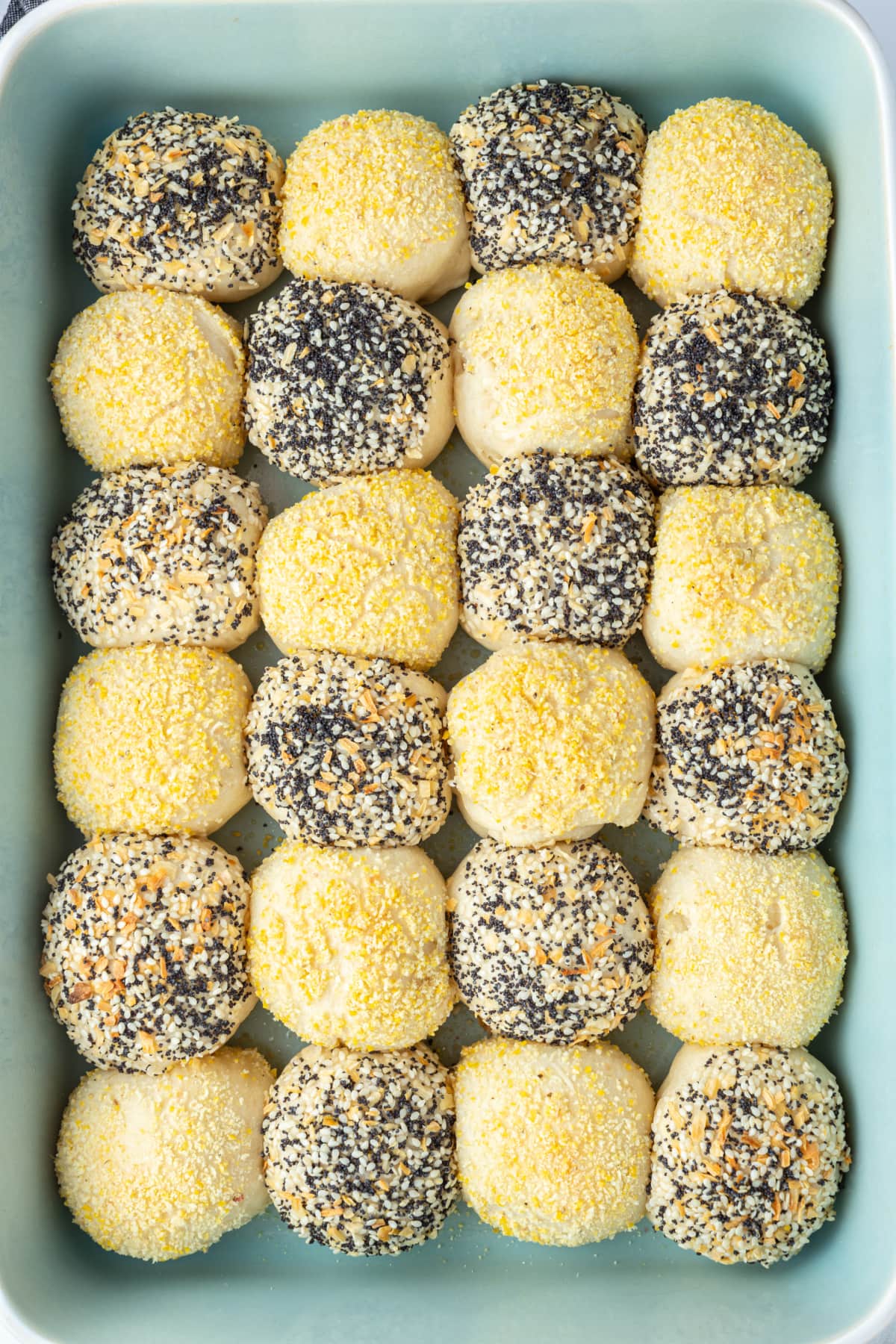 checkerboard dinner rolls in a baking pan