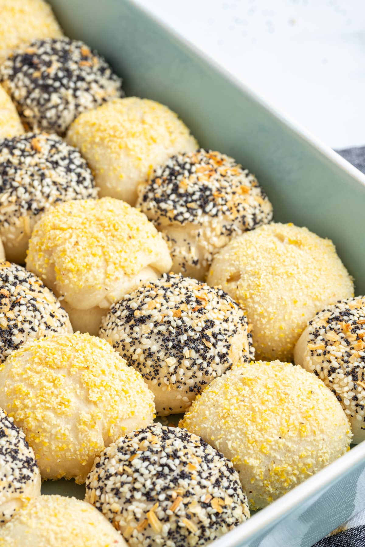 checkerboard dinner rolls in baking dish