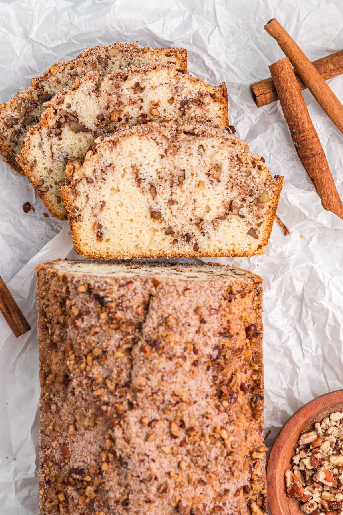 overhead shot of cinnamon pecan bread with some sliced