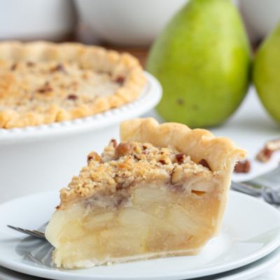 slice of ginger pear pie on a plate