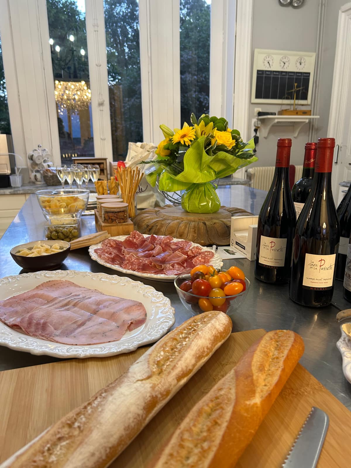 charcuterie and wine display in kitchen at chateau de valcreuse