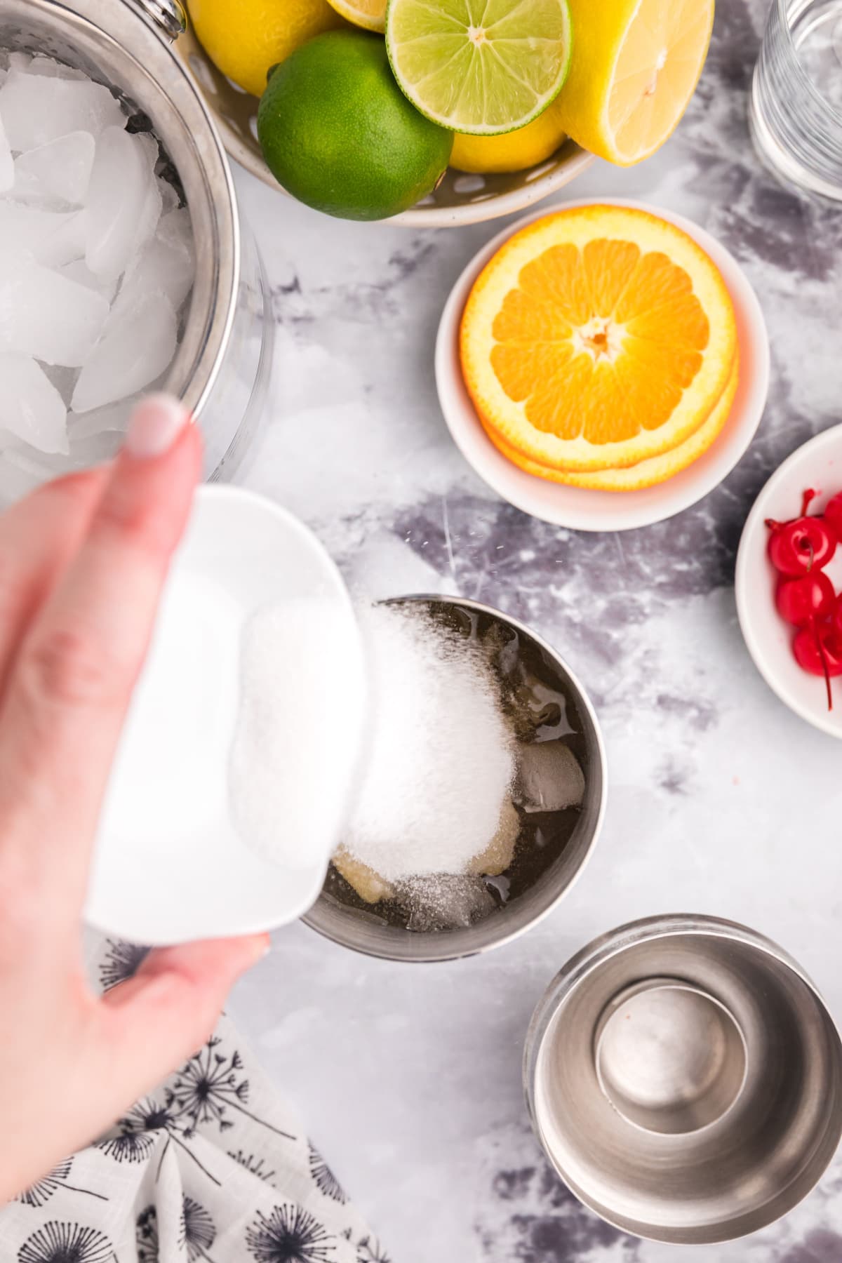 pouring sugar into cocktail shaker