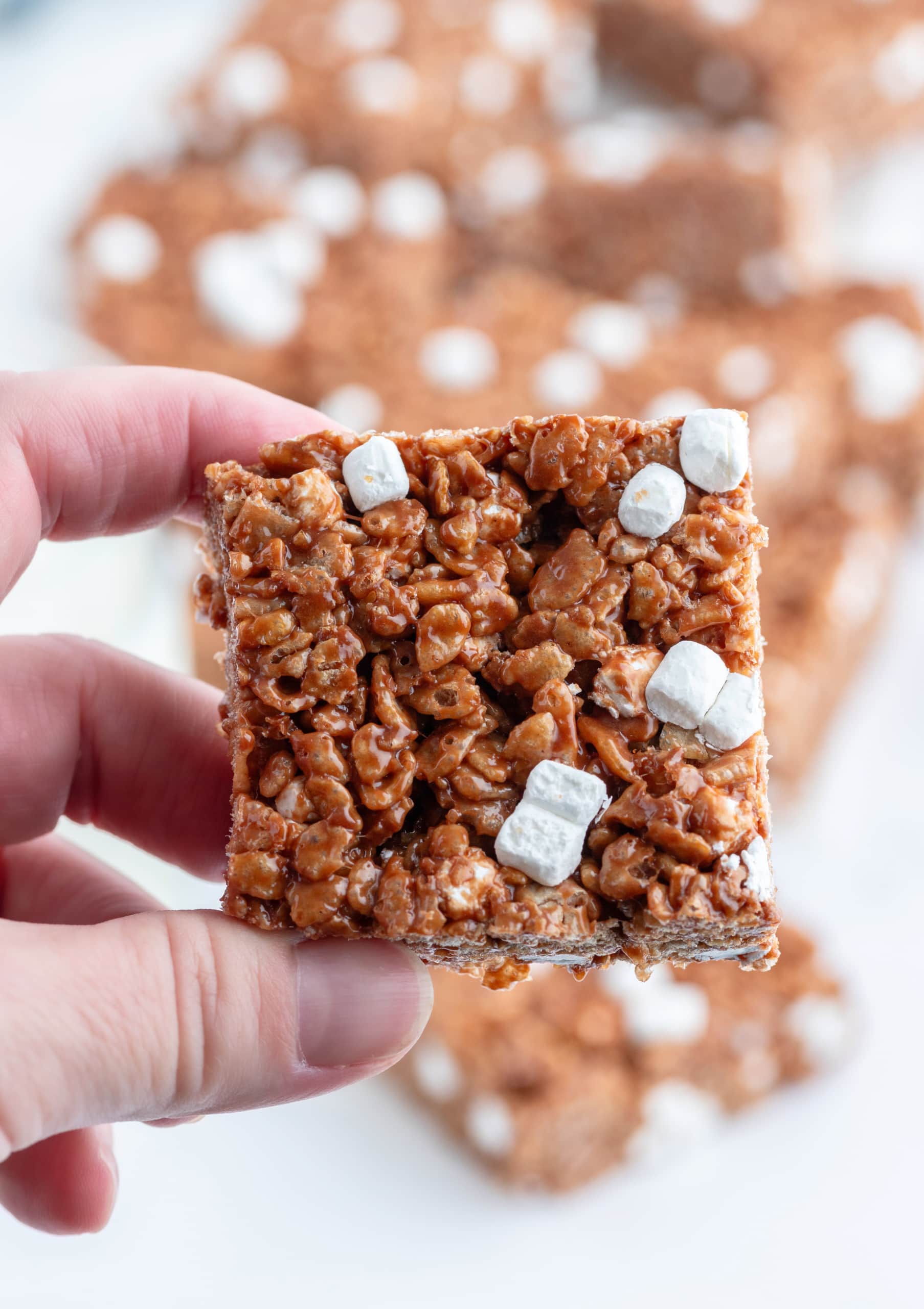 hand holding hot cocoa rice krispie treat