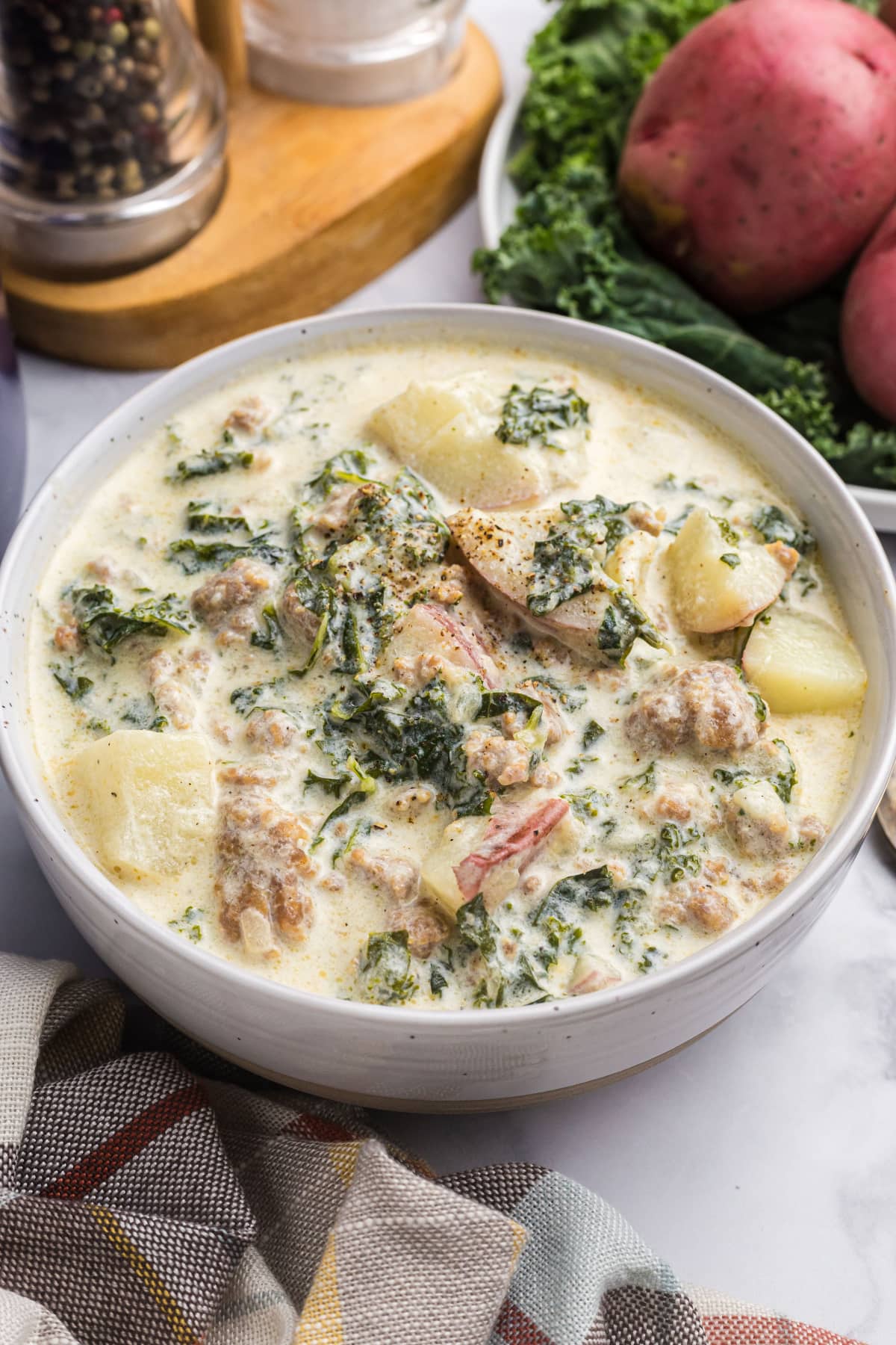 potato sausage and kale soup in a bowl