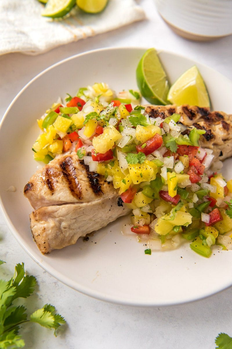 red snapper with pineapple salsa on plate