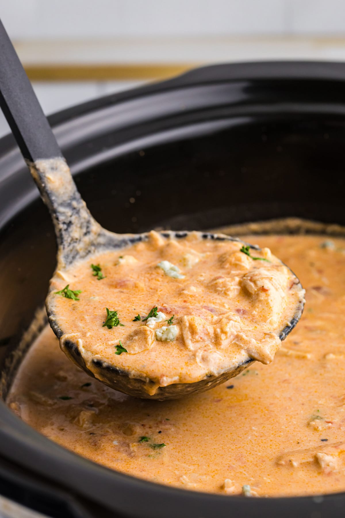 ladle of buffalo chicken soup in pot