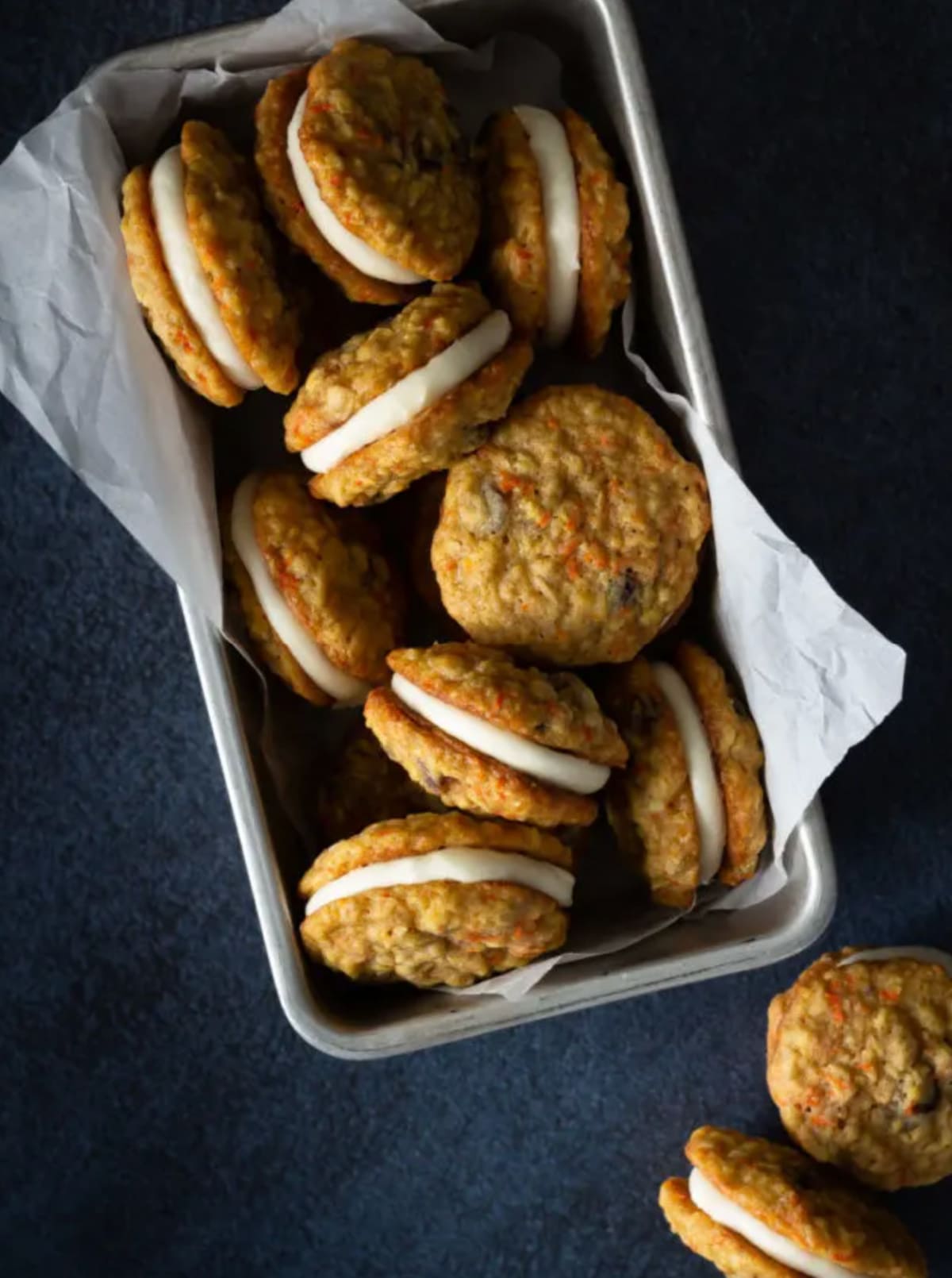 lots of carrot cake sandwich cookies in container