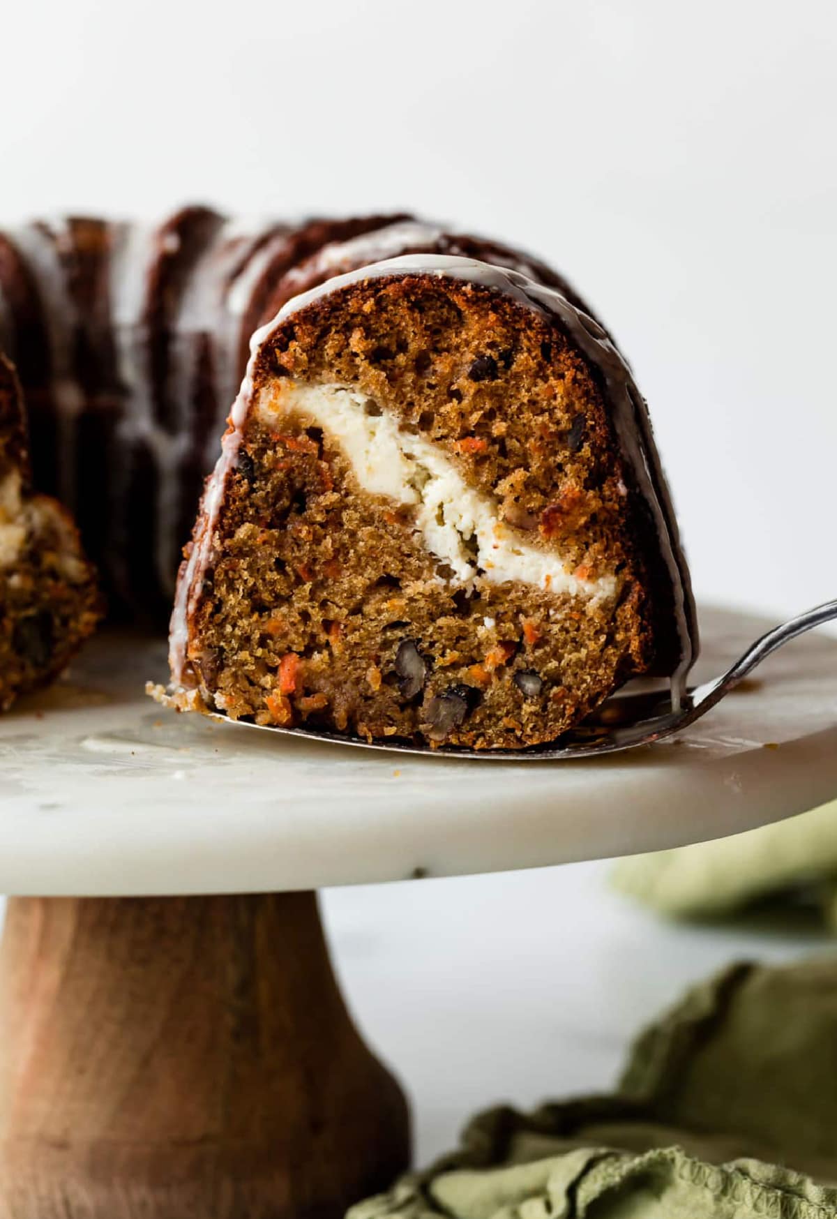 cheesecake swirl carrot bundt cake sliced open