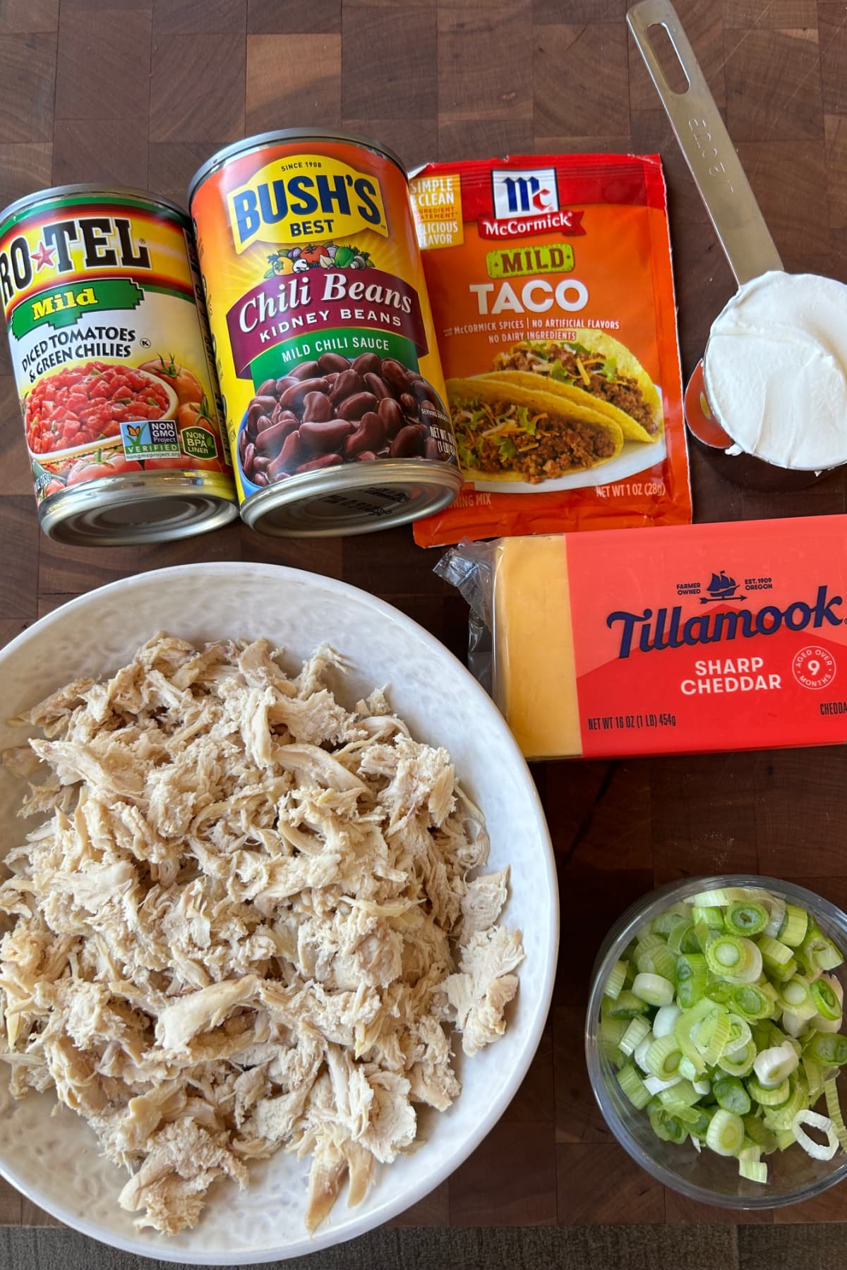 ingredients displayed for making slow cooker chicken taco dip