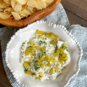 overhead shot of dill pickle dip and potato chips