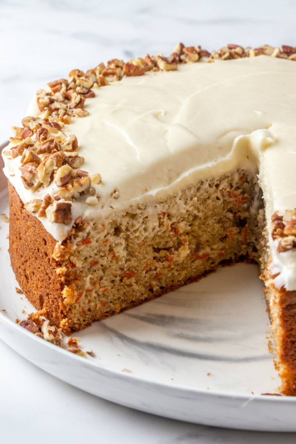 one layer carrot cake with slice taken out