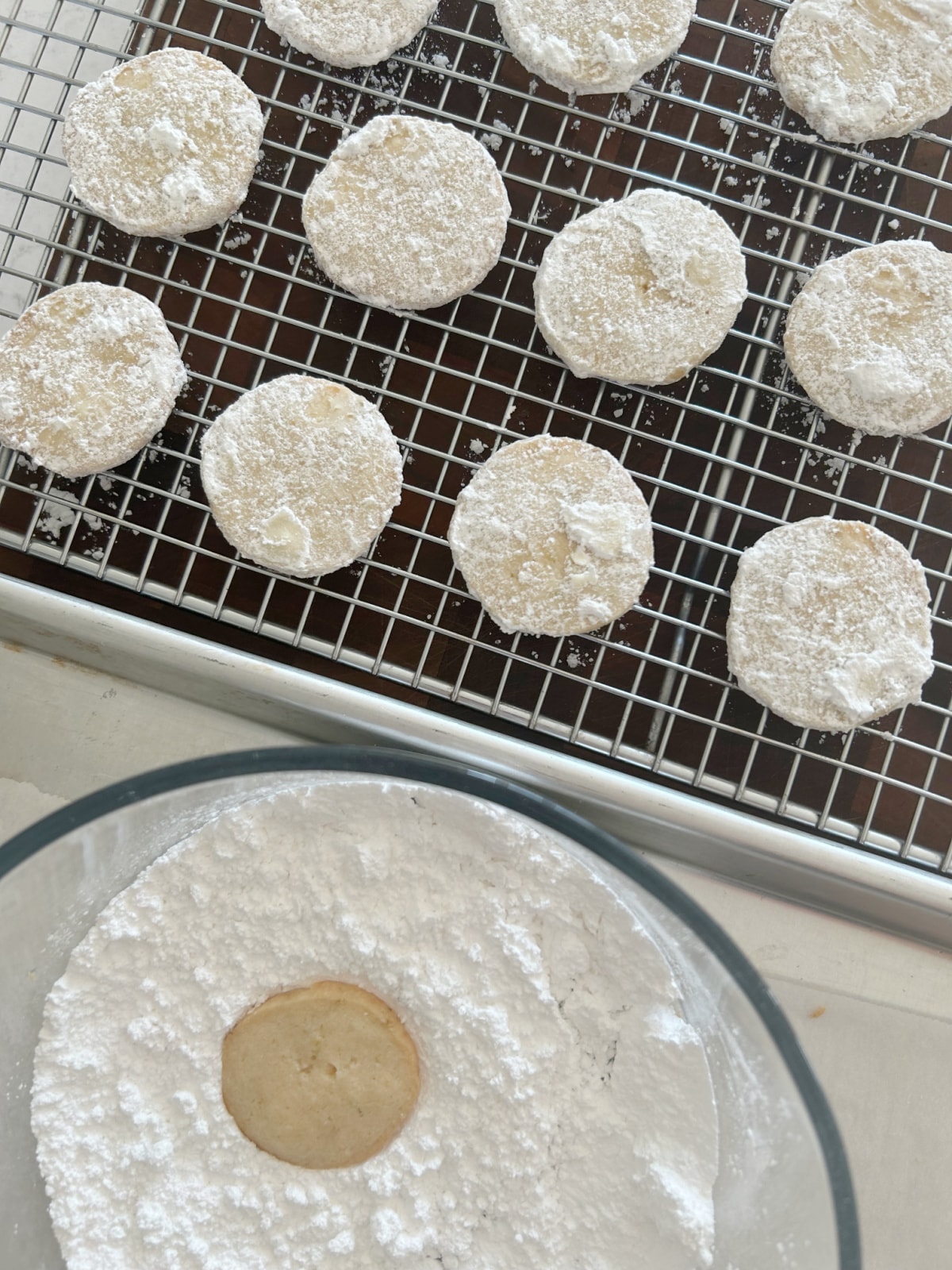 dunking lime meltaways in powdered sugar