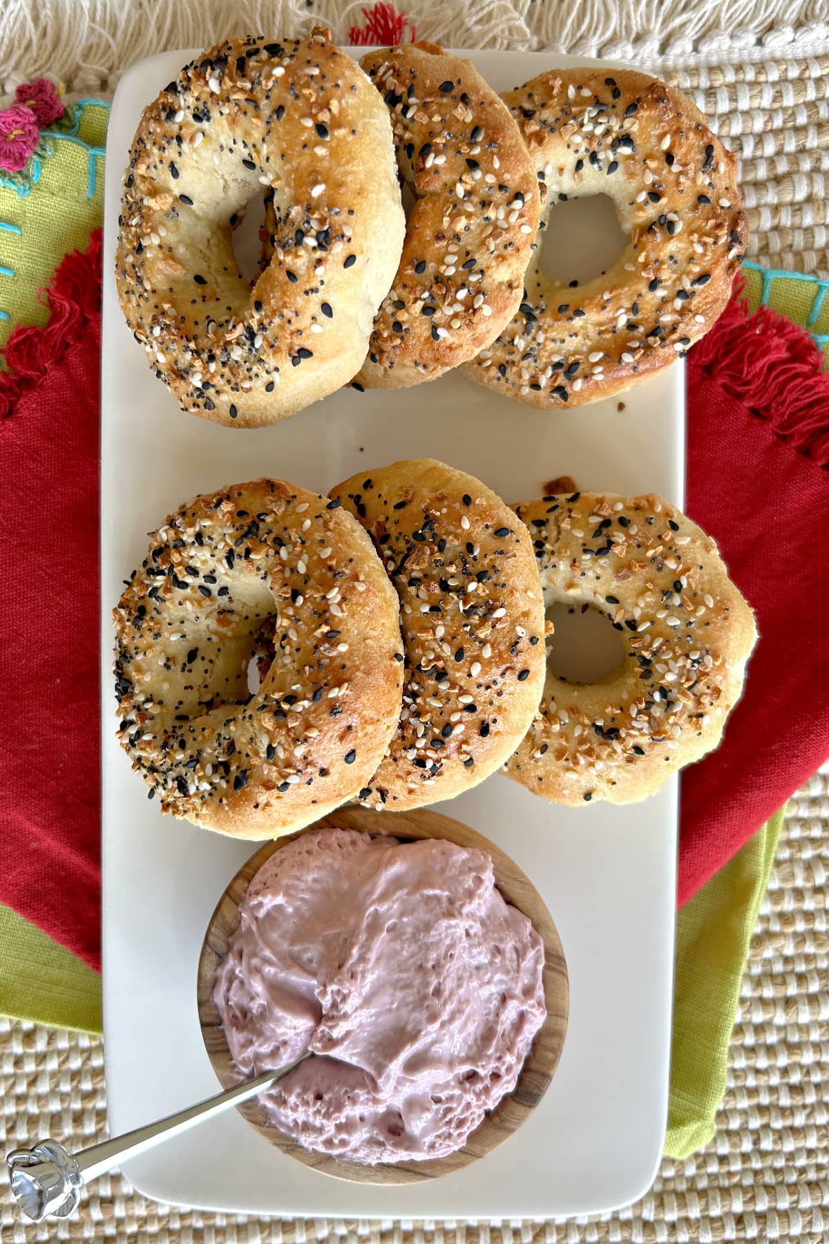 almond flour bagels displayed on platter with berry cream cheese